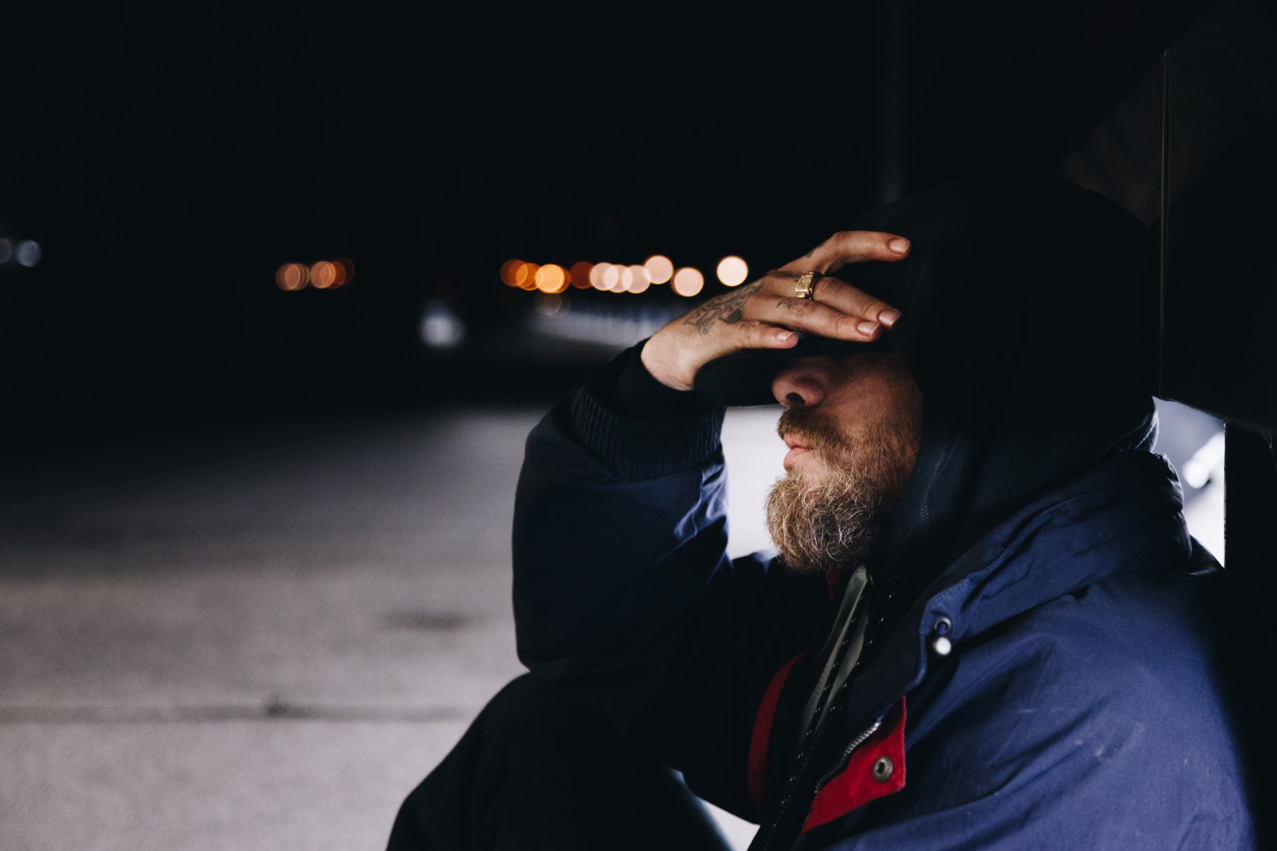 an image of a man contemplating the cycles of addiction and how it impacts someones life as well as triggers to notice.